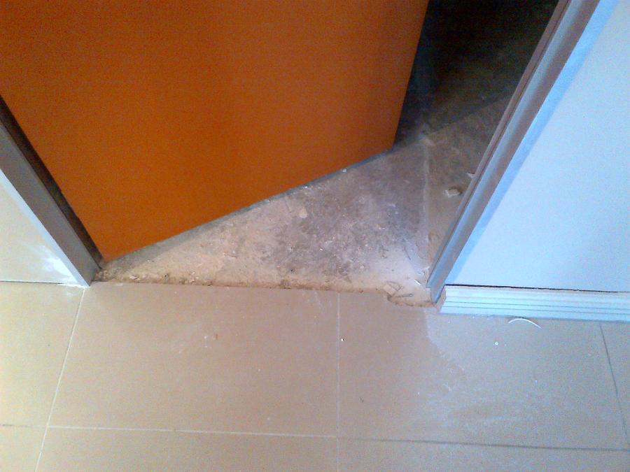 Proceed to WBHO Midrand and Chop and replace 2x tiles in 1st cubicle door entrance Sandton2013011401222-2008.jpg